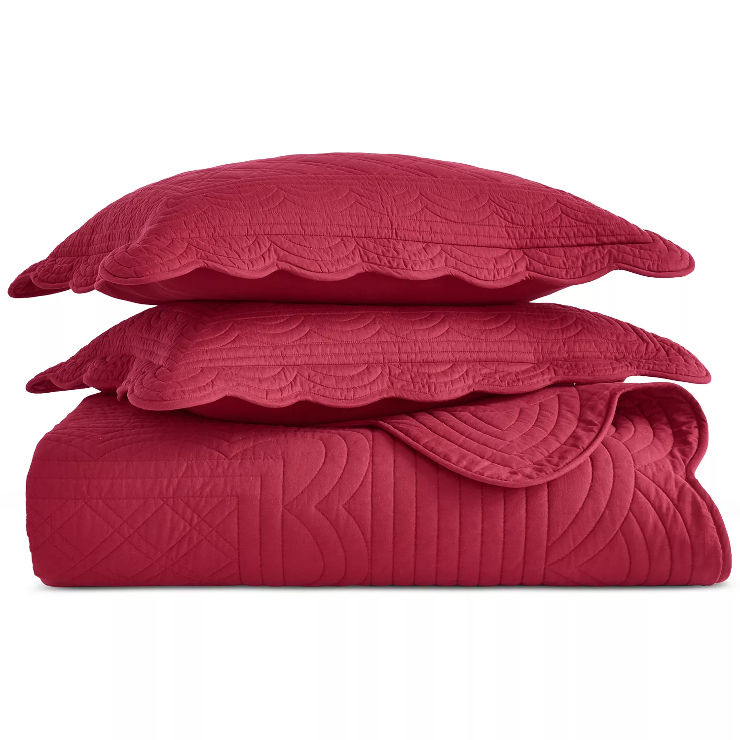 Red quilted bedding set with two pillows featuring scalloped edges and intricate stitching.