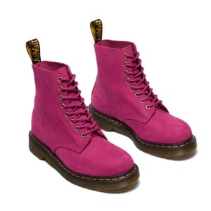 Pink lace-up boots with a sturdy sole and yellow stitching.