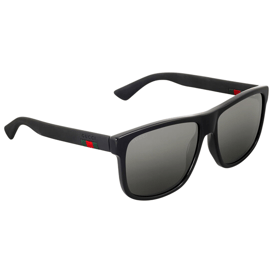 Black rectangular sunglasses with a matte finish and dark lenses, featuring the Gucci logo and green-red detail on the temples.