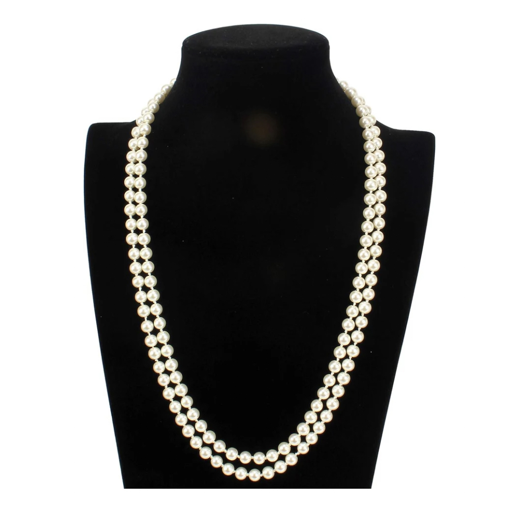 A double strand of iridescent white shell pearls is displayed on a black neck mannequin, creating an elegant, layered necklace.