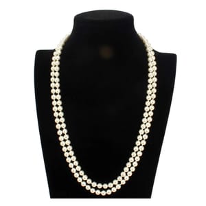 A double strand of iridescent white shell pearls is displayed on a black neck mannequin, creating an elegant, layered necklace.