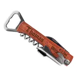 A wooden-handled multi-tool corkscrew engraved with the name \“Thomas\“ and the date \“10.12.2006,\“ featuring a bottle opener and foil cutter.