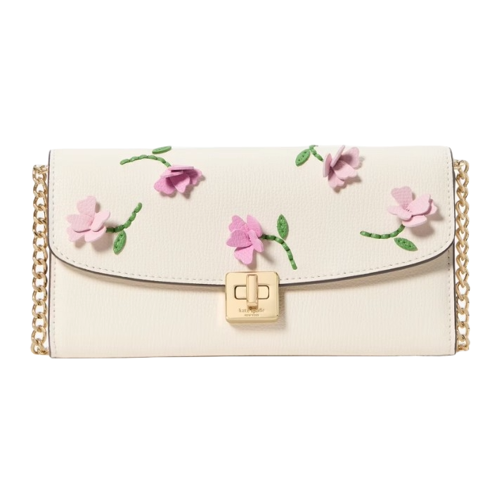 Cream leather crossbody with pink floral appliques and green stems, featuring a gold turn-lock closure and a gold chain strap.