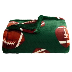 A green fleece blanket featuring a pattern of American footballs.