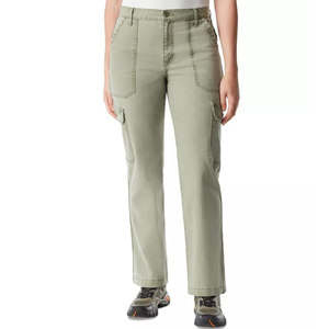 A person wearing green cargo pants and black sneakers with orange details.