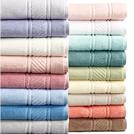 Stacked colorful towels in various pastel shades.