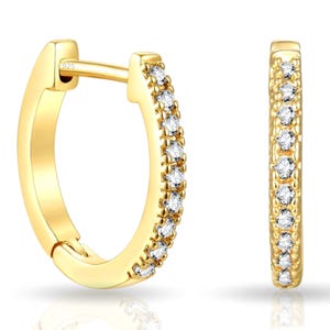 Gold hoop earrings with a hinged clasp, featuring a row of small round white gemstones on the outer side.