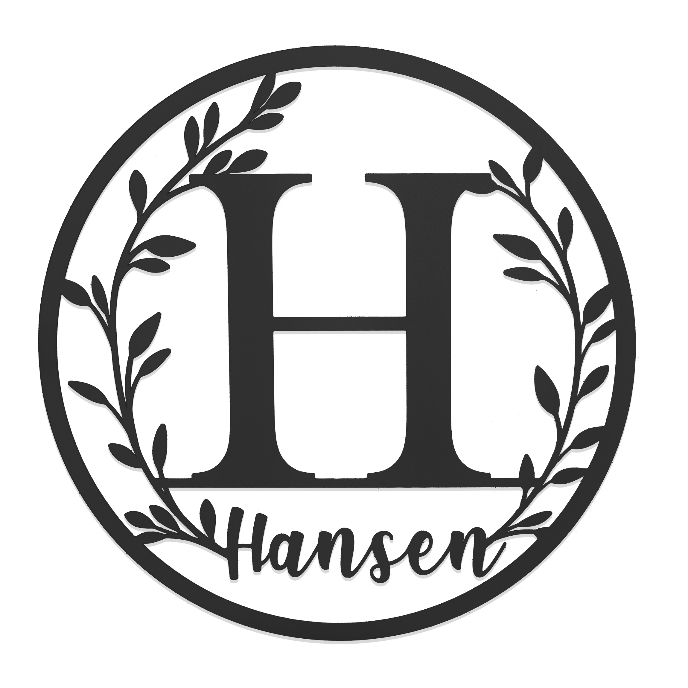A circular monogram sign featuring a large letter \“H\“ surrounded by a leafy wreath design, with the name \“Hansen\“ written below in a script font.