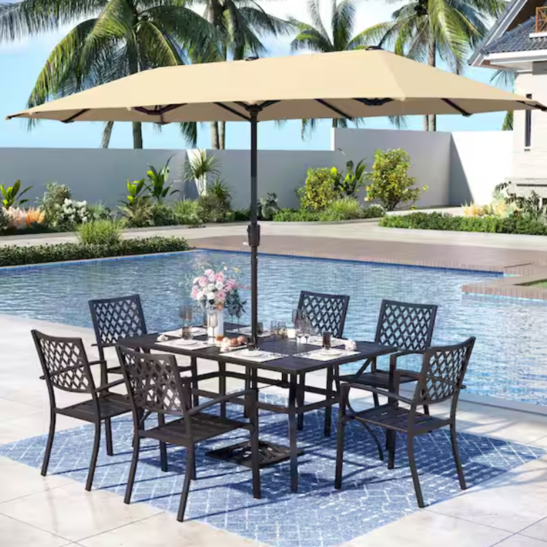 8-piece metal dining set includes a rectangular table with lattice chairs and a beige umbrella. The setting is placed on a blue patterned rug beside a pool, with tableware and a small flower arrangement on the table.