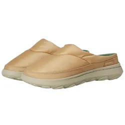 A pair of tan slip-on shoes with a cushioned design and sturdy sole, featuring branding on the side.
