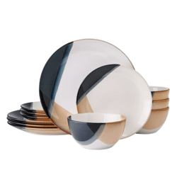 A set of dinnerware featuring plates and bowls with an abstract design in black, tan, and white colors.