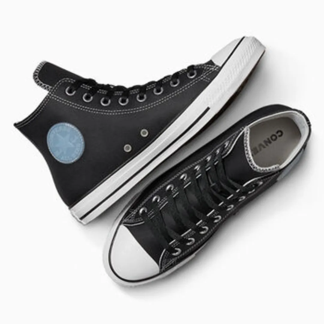 A pair of high-top, black canvas sneakers with white laces and rubber soles.