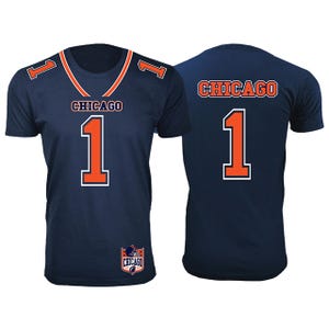 Front and back view of a blue sports t-shirt with orange trim, featuring the number 1 and the word \“CHICAGO\“.