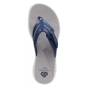 A single navy blue flip-flop with a white sole and dotted pattern.