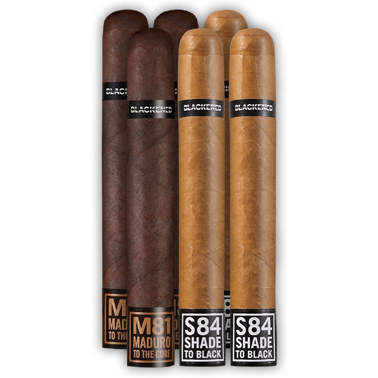 The 6pk Blackened Cigar Sampler includes three Maduro M81 cigars and three Shade S84 cigars, each with distinct wrappers and labeled bands, offering a variety of flavors.