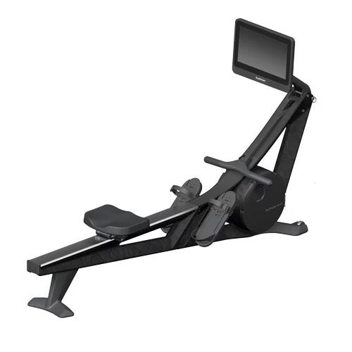 A sleek, black rowing machine designed with a sliding seat, footrests, and an integrated monitor on an inclined rail.