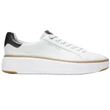 White low-top sneaker with black heel detail, featuring a platform sole and branded with \“Cole Haan\“.