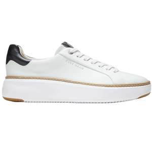 White low-top sneaker with black heel detail, featuring a platform sole and branded with \“Cole Haan\“.