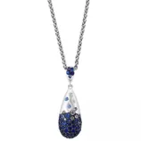 A silver necklace features a teardrop-shaped pendant adorned with blue and clear crystals, suspended from a silver chain.