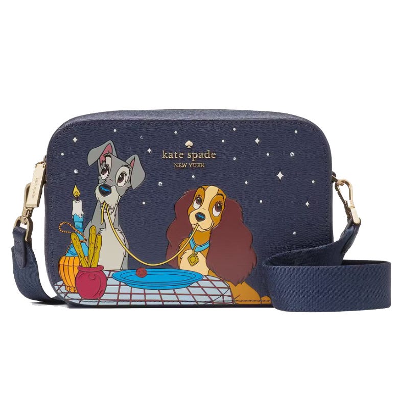 A blue crossbody bag with an illustration of two animated dogs sharing a spaghetti meal.