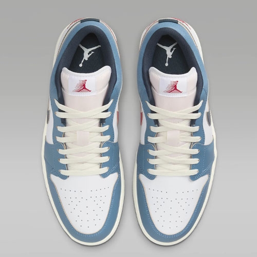 A pair of light blue and white high-top sneakers with the Jumpman logo on the tongues.