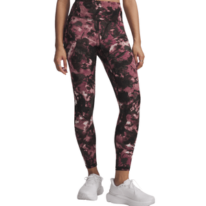 Leggings with a pink and black abstract pattern, worn with white sneakers.