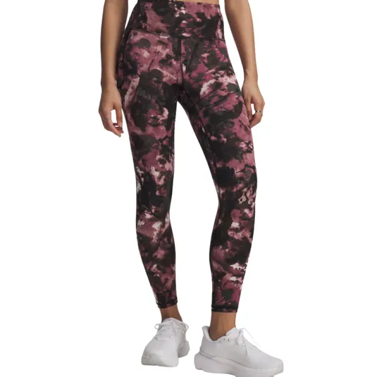 Leggings with a pink and black abstract pattern, worn with white sneakers.