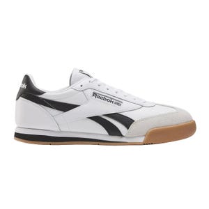 Reebok classic sneaker in white with black detailing, featuring a gum sole and suede accents on the toe.