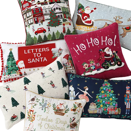 A collection of festive throw pillows with various Christmas-themed designs including Santa Claus, reindeer, Christmas trees, and holiday greetings.