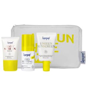 The Supergoop! 4-piece sunscreen kit includes Glow Screen SPF 40, (Re)Setting Refreshing Mist SPF 40, Unseen Sunscreen SPF 40, and a branded pouch.