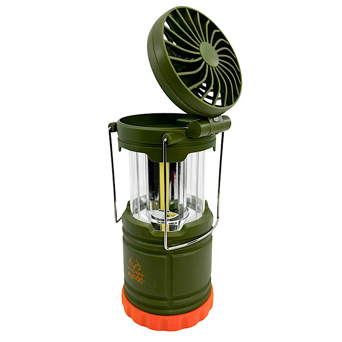 A green camping lantern with a built-in fan on top and collapsible metal handles, featuring a textured orange base.