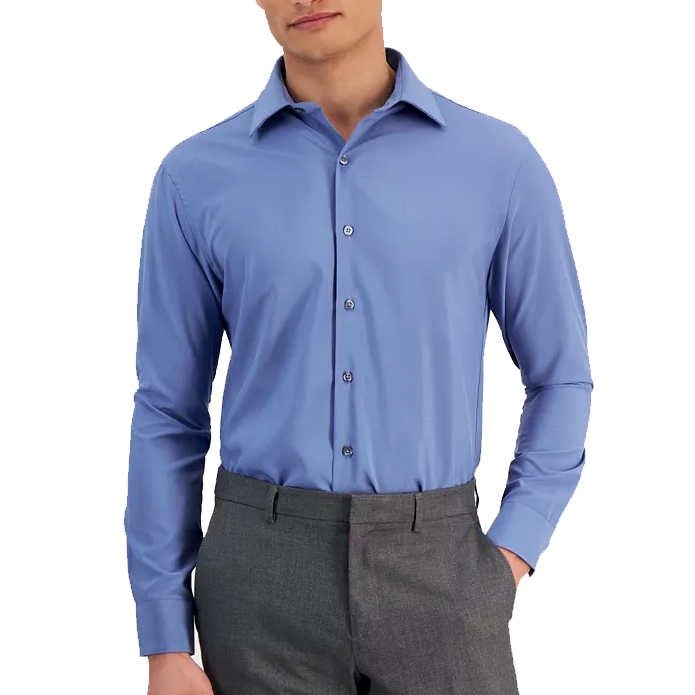 A man is wearing a light blue long-sleeve dress shirt paired with gray trousers.