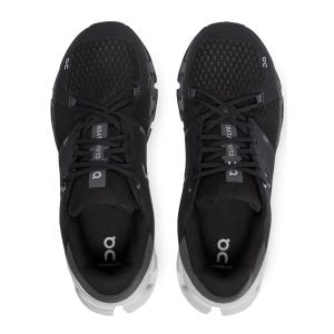 A pair of black On Cloud X running shoes with white soles viewed from above.