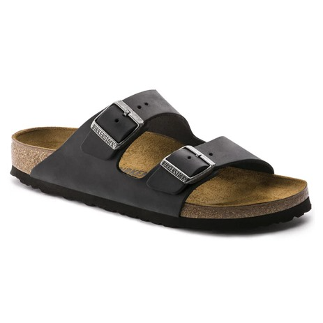 A black sandal with two adjustable buckles and a cork footbed, resembling a Birkenstock style.