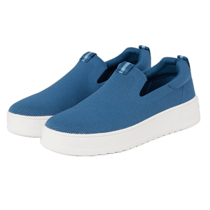 A pair of blue slip-on sneakers with white soles.