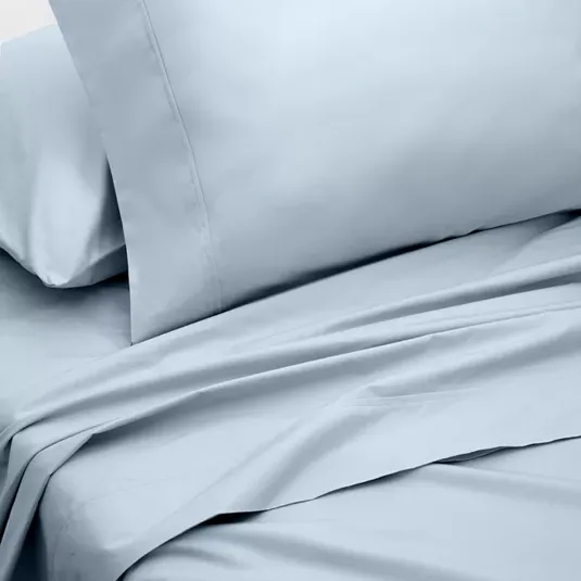 Light blue bed sheet set with a plain design, including a pillowcase and a flat sheet.