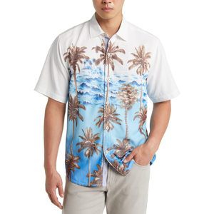 Short sleeve button-up shirt featuring a tropical design with palm trees and ocean waves on a white and blue background.