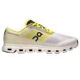 Yellow and white athletic shoe with a distinctive sole design featuring multiple rectangular cutouts, branded with a stylized logo on the side.
