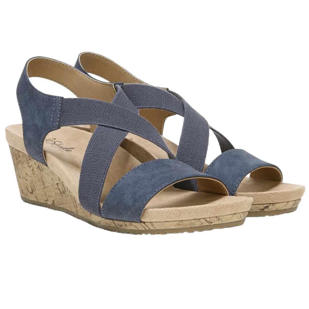 Blue wedge sandals with crisscross elastic straps and a cork-textured heel.