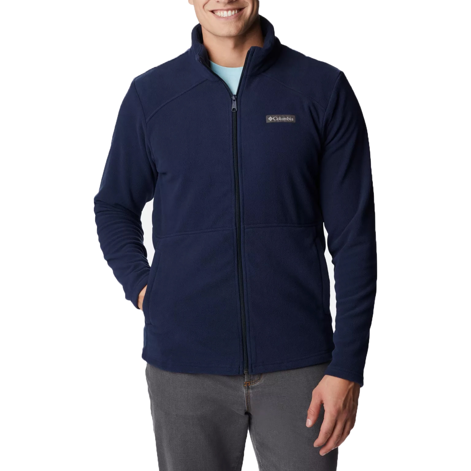 A man wearing a navy blue Columbia fleece jacket with a zip-up front and the brand logo on the chest.
