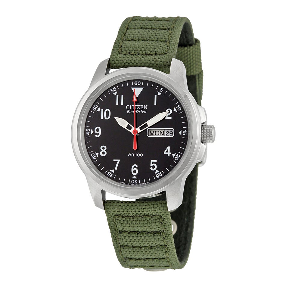 A Citizen Eco-Drive wristwatch with a black dial, white numerals, and a green canvas strap.