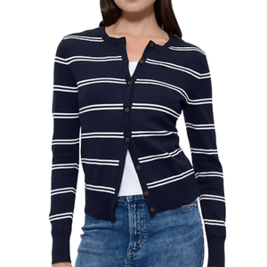 A navy blue cardigan with white horizontal stripes, featuring a button-up front and long sleeves, paired with blue jeans and a white top.