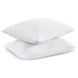 Two white pillows with a subtle striped pattern, stacked on top of each other.