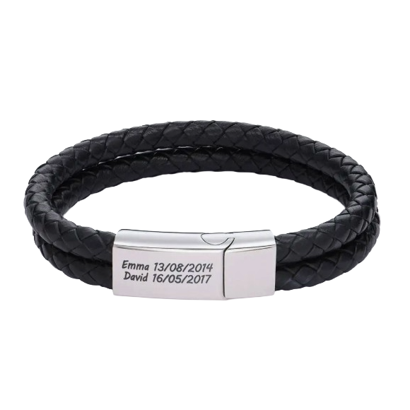 A black double-strand braided leather bracelet features a silver clasp engraved with \“Emma 13/08/2014\“ and \“David 16/05/2017.\“