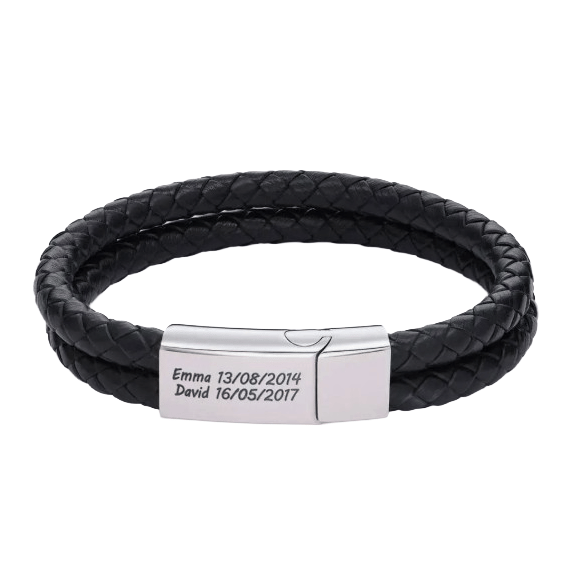 A black double-strand braided leather bracelet features a silver clasp engraved with \“Emma 13/08/2014\“ and \“David 16/05/2017.\“