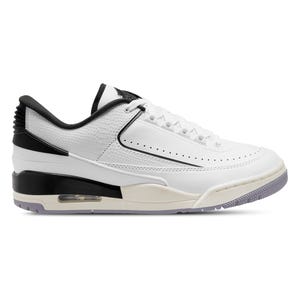 White and black low-top sneaker with air cushioning visible in the heel.