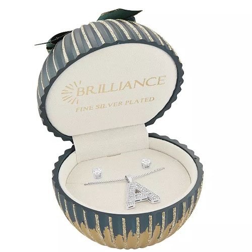 Christmas-themed jewelry gift box containing a fine silver-plated necklace with a crystal-studded 'A' pendant and matching stud earrings.