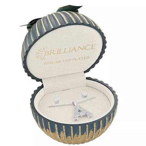 Christmas-themed jewelry gift box containing a fine silver-plated necklace with a crystal-studded 'A' pendant and matching stud earrings.