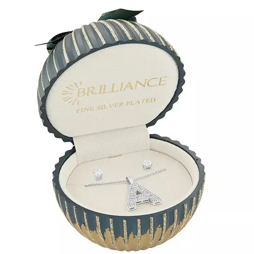 Christmas-themed jewelry gift box containing a fine silver-plated necklace with a crystal-studded 'A' pendant and matching stud earrings.