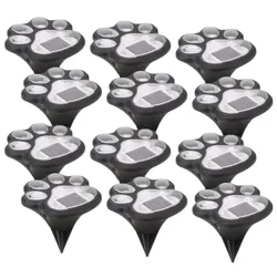 Set of solar-powered outdoor lights designed to look like paw prints, each featuring a ground stake for easy installation.